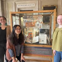 MSLIS students Yung-hui Chou, Alice Tierney-Fife, and Elizabeth Workman stand next to the winning exhibit