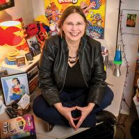 Carol Tilley in her office surrounded by comics